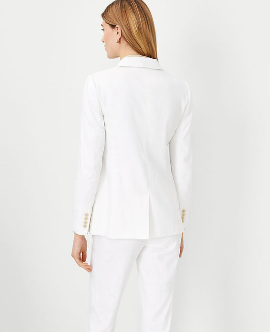 Le blazer long à bouton unique et revers crantés en mélange de lin chevrons