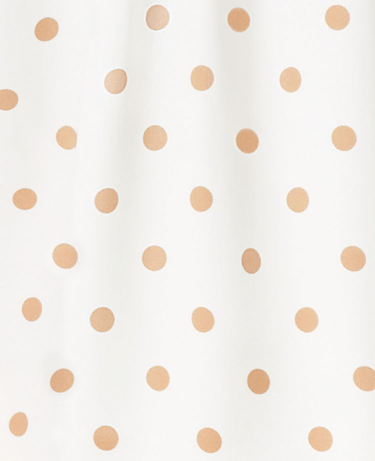 Blouse à pois et épaules tombantes