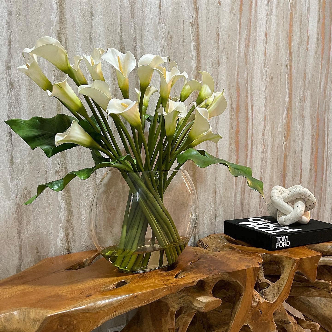 Moon vase with white calla lilies