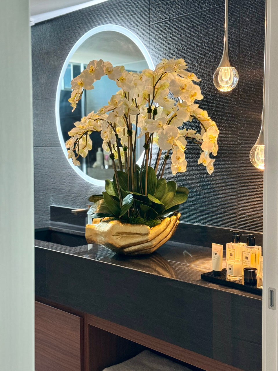 White Phalaenopsis Orchids in Gold Open Hands Sculpture Vase