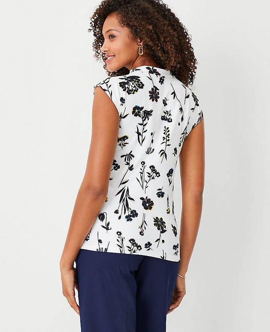 Haut à col montant raffiné extensible à motif floral