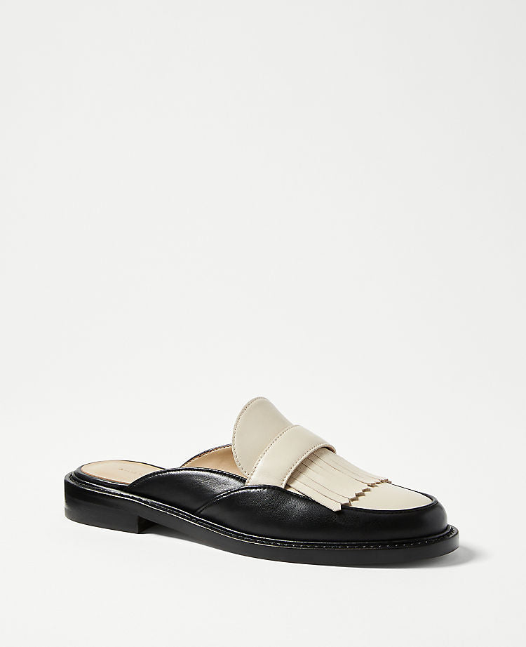 Mules à pompons Kiltie en cuir