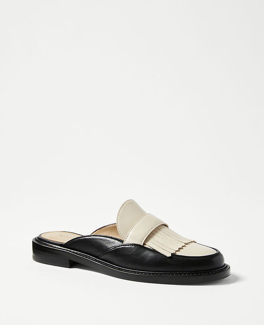 Mules à pompons Kiltie en cuir