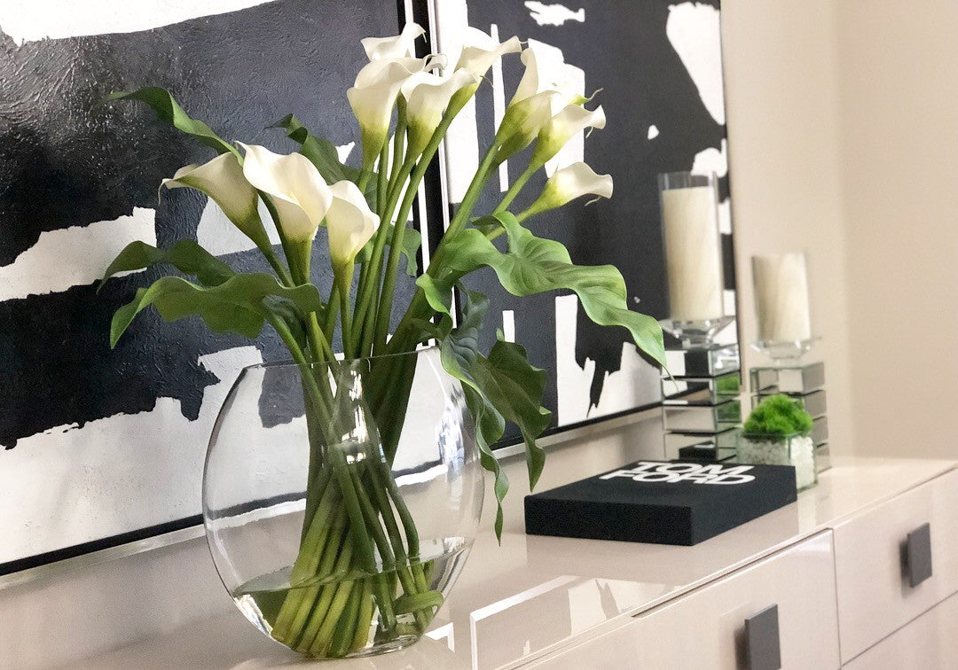 Moon vase with white calla lilies